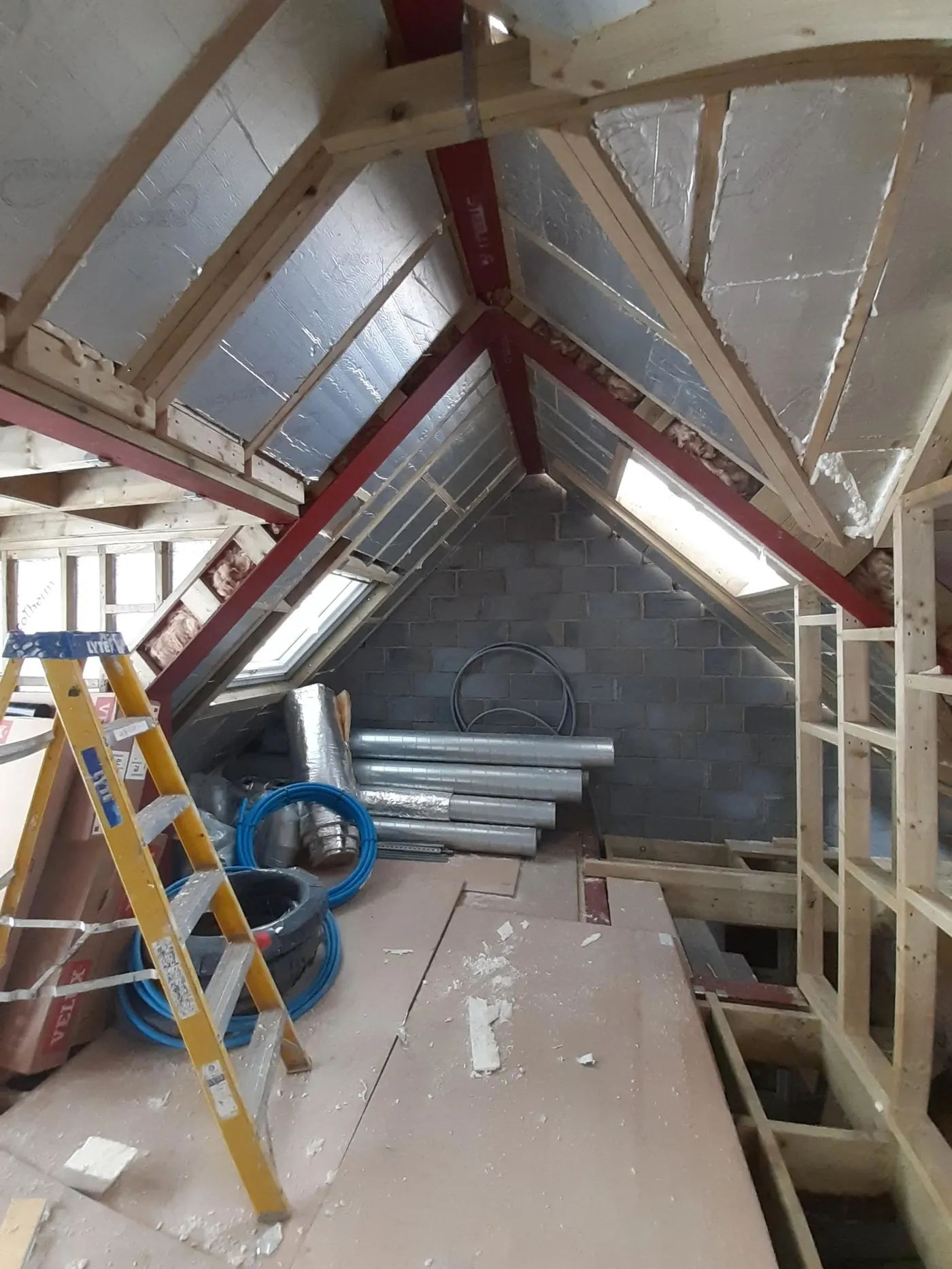 Loft space mid-conversion with roof steels and insulation