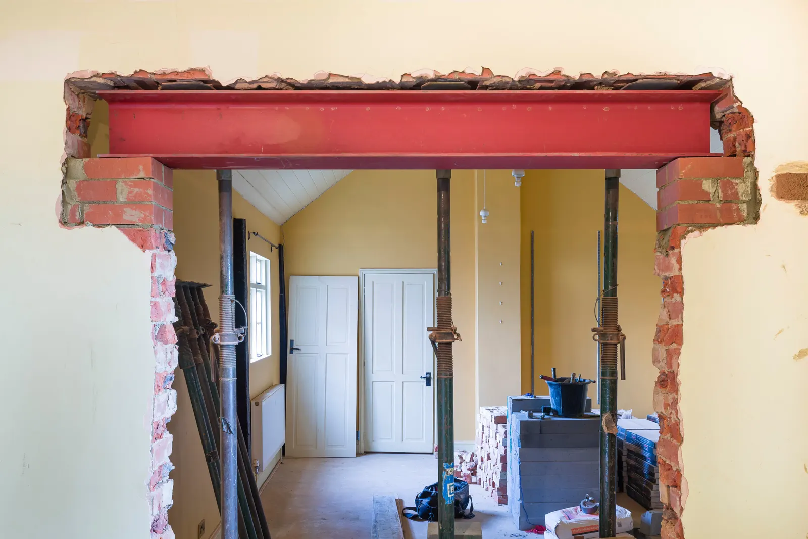 Steel beam installed over a load-bearing wall opening